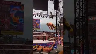 Logan Paul from the top rope onto the miz