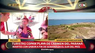 Turistas copan la playa de Carmen del Paraná