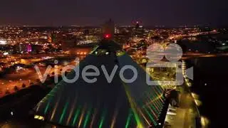 Beautiful night aerial shot of the Memphis pyramid Hernando De Soto Bridge and downtown Memphis city