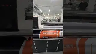 How does a vision-guided hybrid UV printer print roll materials for vehicle decals?