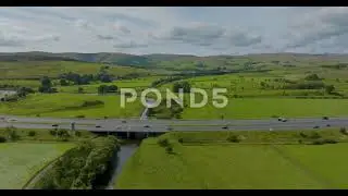 Aerial Flight Over Motorway With Green Landscape View United Kingdom Uk - 4k Stock Footage