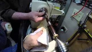 Applying finish to a wood turned pen.