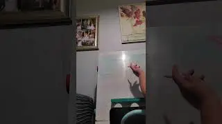 Athena KP playing teacher with her white board on multiplication part 1