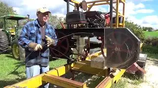 Sawing with our home built Bandmill, and what happens when the blade hits a piece of steel