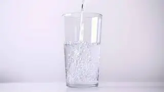 Pouring Water Into A Glass
