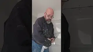 Taping the sheetrock around the shower. 