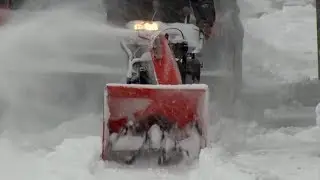 Plows And Blowers Cleaning Up Snow During Winter Storm