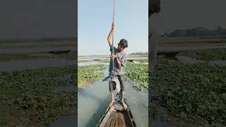 The Struggle for Livelihood: A Young Man Fishing from a Boat