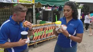 Dustin Grove and Felicia Lawrence taste-test food at the Indiana State Fair