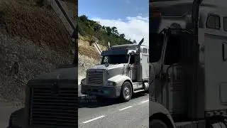 Fully loaded tractor trailer going down hill