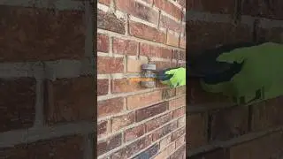 Raking white mortar brickwork
