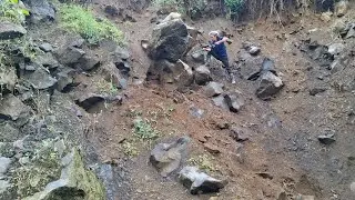 Rockman in action dropping large cracked rocks