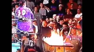 Dudley boyz put spike dudley through a flaming table!!.