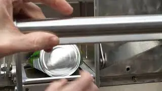 Crush a small steel can, tin can, food can