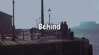 Behind