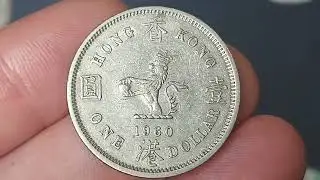 Монета 1 доллар Гонконга 1960 года. Стоимость + обзор. Королева Елизавета II