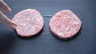 Frying Two Burger Patties Stock Footage