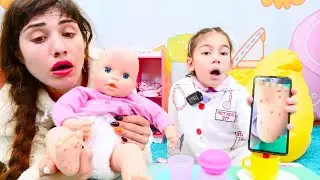 Çocuklar için doktor oyunu. Oyuncak bebek Anabelle el ayak hastalığı kapmış. Bebek bakma oyunu.