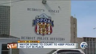Mayor going to court to keep city police pay cut in place