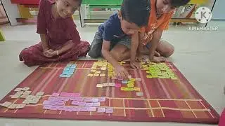 Sentence formation with word tiles by ukg children