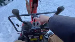 Jims excavator #59 - moving a round bale.