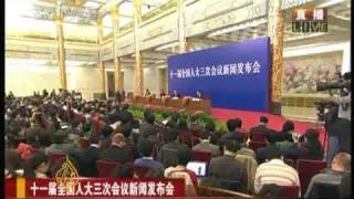 China reins in arms budget