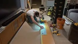Installation of entertainment unit and bar cabinets in the basement.