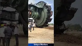 Bucket-wheel excavator in action: people using a bucket-wheel excavator