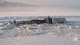 ALL TERRAIN VEHICLE MTLB KAMAZ PULLS OUT STUCK IN THE SNOW ROAD NORTH