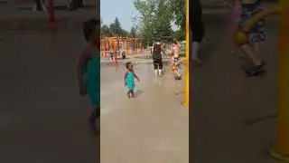 Cutest little girl having fun with water