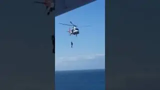 Pilot disembarking Ship by Helicopter