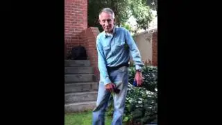 Paul zaps himself with a shock stick.