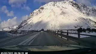 Driving along the E10 through the snow in Lofoten, Norway