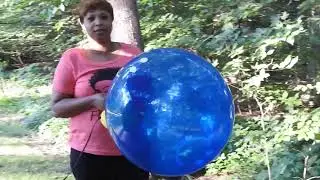 Carolyn's BIG blue balloon popping
