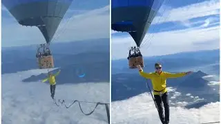 German slackliners' walk between hot air balloons at 2.5 km altitude.
