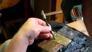 Demonstrating kanji carving in kata-kiri bori.