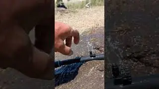 Different types of small irrigation nozzles to water young avocado trees in Fresno county