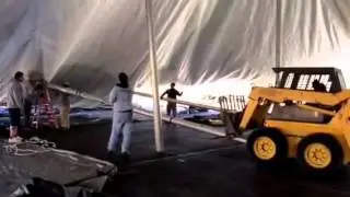 Installation of 80'x90' tent: Standing up center poles, rope and pole tent setup