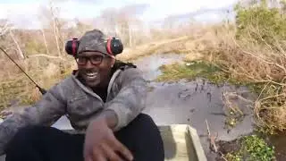 DUKE DENNIS SCARED OF TOUCHING AN ALLIGATOR FIRST TIME EVER IN NEW ORLEANS FOR SUPER BOWL WEEK.