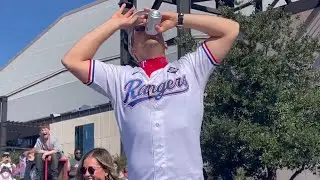Nathaniel Lowe catches a beer, chugs it and takes off his shirt at championship parade