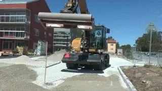 Cat 313D levels the gravel outside Visby June 2016