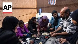 Families in Gaza search desperately for food and water, wait in long lines for aid