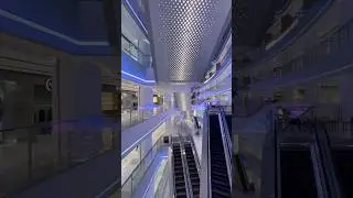 The mall's lighting dazzles like the glow of a spaceship