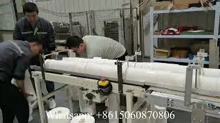 Automatic machine for packaging small toilet paper