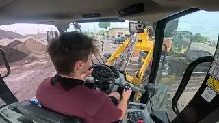 CAT 908M Wheel Loader Hard at Work Loading Trucks on a Busy Morning! - POV