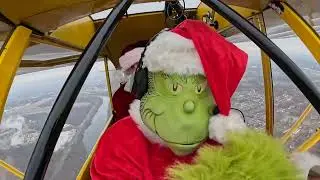 Grinch Joins Santa on Helicopter Ride to Take Christmas Spirit to the Skies