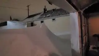 Buffalo Garage Door Opens to Reveal Wall of Snow