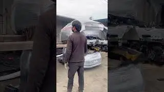 Packing used cars to send to the middle east market.