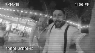 Groom and Best man jump in pool with Tuxedos at Wedding