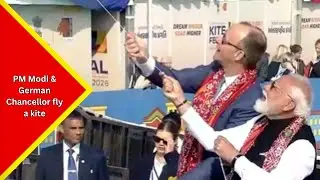 Prime Minister Narendra Modi and German Chancellor Friedrich Merz fly a kite in Ahmedabad...